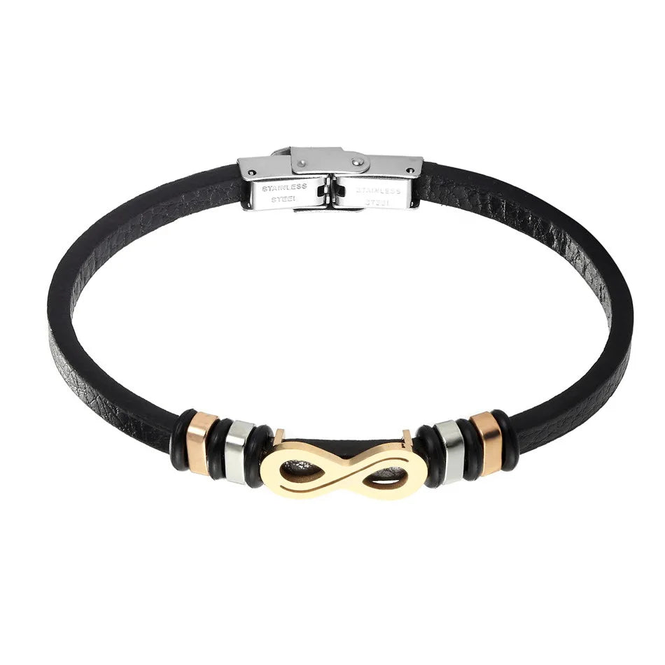 A black leather bracelet featuring a stylish gold clasp, showcasing a blend of elegance and modern design.