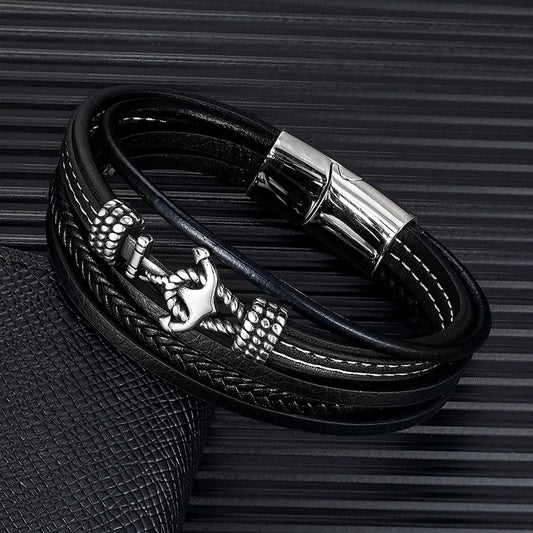  A sleek black leather bracelet adorned with an anchor, combining elegance and maritime charm in one accessory.