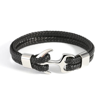 A chic black leather bracelet adorned with a distinctive anchor clasp, ideal for adding a touch of maritime flair.