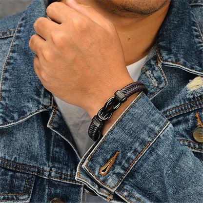 A man in a denim jacket accessorized with a stylish bracelet, exuding a casual yet fashionable vibe.