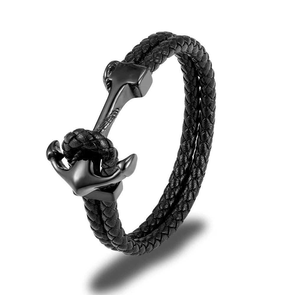  A sleek black leather bracelet adorned with a metallic anchor, combining elegance with a maritime touch.