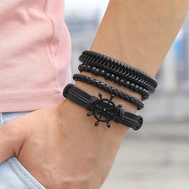  A man showcasing a stylish coffee leather bracelet on his wrist, highlighting its elegant design and craftsmanship