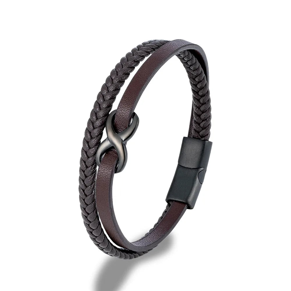 A coffee leather bracelet with a black clasp, prominently displaying an Infinity Knot embellishment on the top