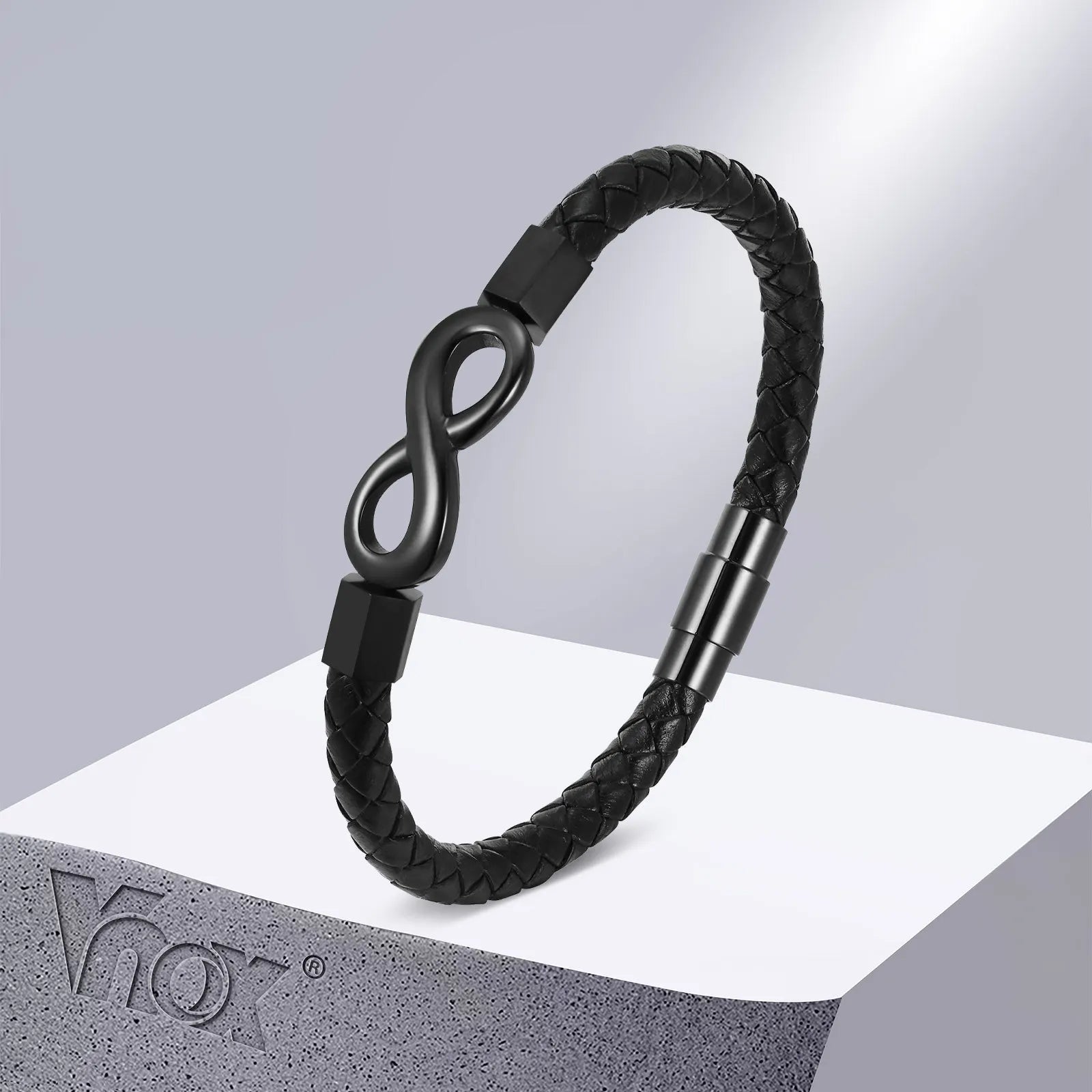 A black leather bracelet featuring a sleek infinity symbol, symbolizing endless love and connection.