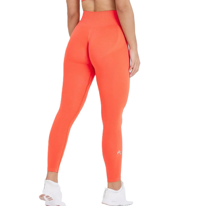 Bright orange leggings worn by a person on a white background