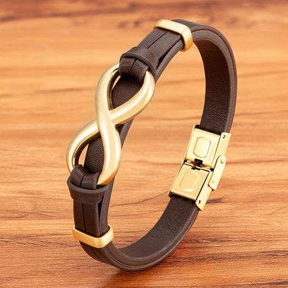 A chic brown leather bracelet adorned with a gold clasp, perfect for adding a touch of luxury to any outfit.