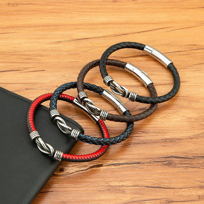 Three colorful leather bracelets displayed alongside a sleek black leather case, showcasing their vibrant designs.